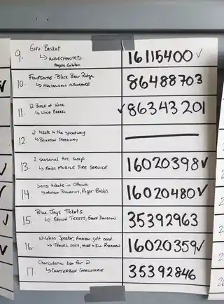 Handwritten prize board listing tournament prizes 9 through 17