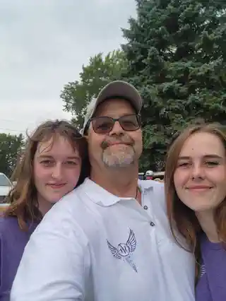 Friends posing together at the memorial golf tournament