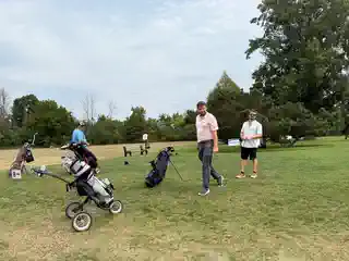 Golfer riding in a cart during the tournament