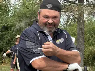 Golfer posing for a portrait on the course