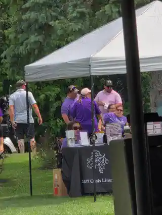 Three Oaks Foundation information table at the tournament