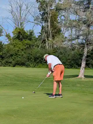 Golfer putting on the course at the 2nd Annual Shannan Hickey Memorial Golf Tournament
